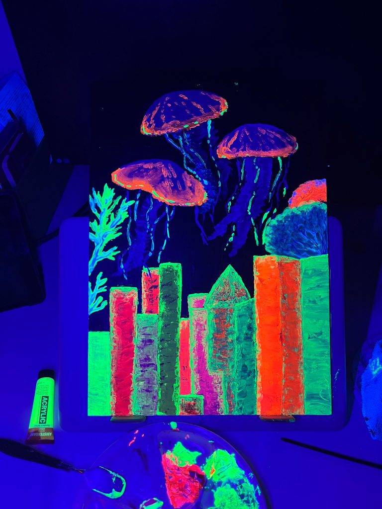 The artwork "Without the Ocean, There Is No City" under ultraviolet light, showing fluorescent acrylic markers and the overall UV composition.